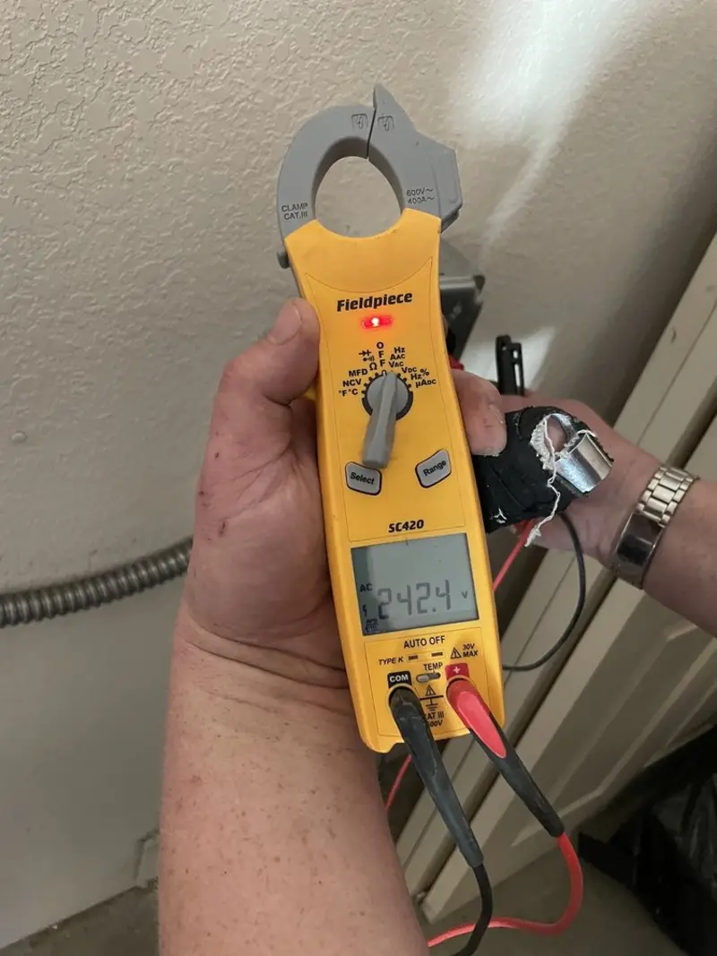 Voltage testing with clamp meter during Electrical Installation Services in St. Marys